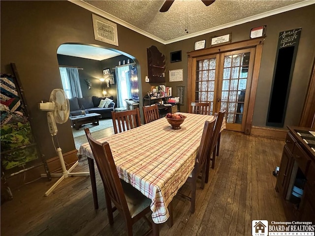 223 S 7th St, Olean-City, NY 14760 - dining room featuring arched walkways, hardwood / wood-style floors, a textured ceiling, crown molding, and ceiling fan
