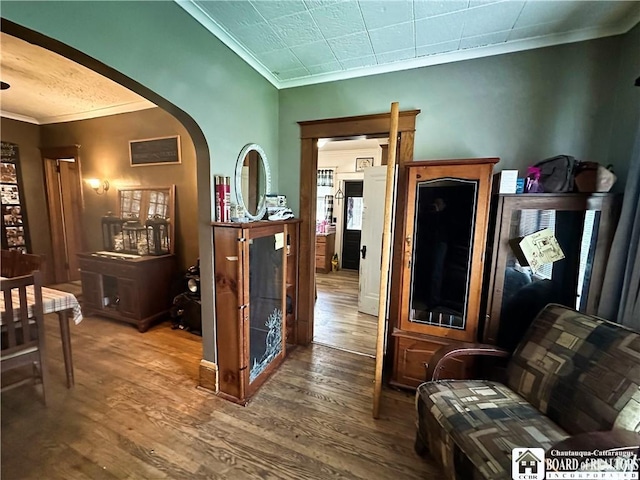 223 S 7th St, Olean-City, NY 14760 - corridor with crown molding, arched walkways, and wood finished floors