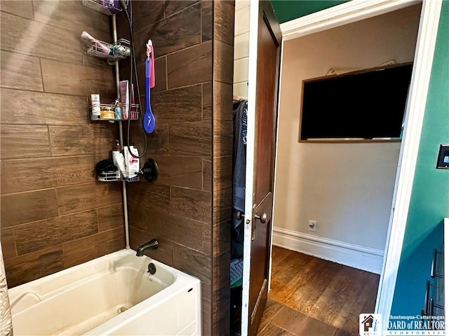 223 S 7th St, Olean-City, NY 14760 - bathroom featuring bathtub / shower combination, baseboards, and wood finished floors