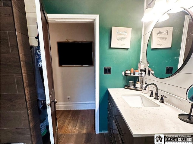 223 S 7th St, Olean-City, NY 14760 - bathroom with vanity, wood finished floors, and baseboards