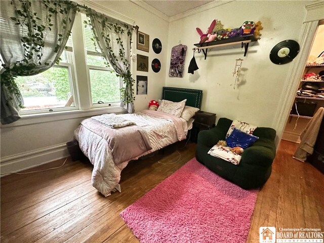 223 S 7th St, Olean-City, NY 14760 - bedroom featuring crown molding and wood-type flooring