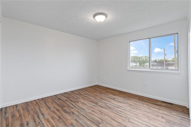 275 Owens Rd Unit 115, Sweden, NY 14420 - unfurnished room featuring wood finished floors and baseboards