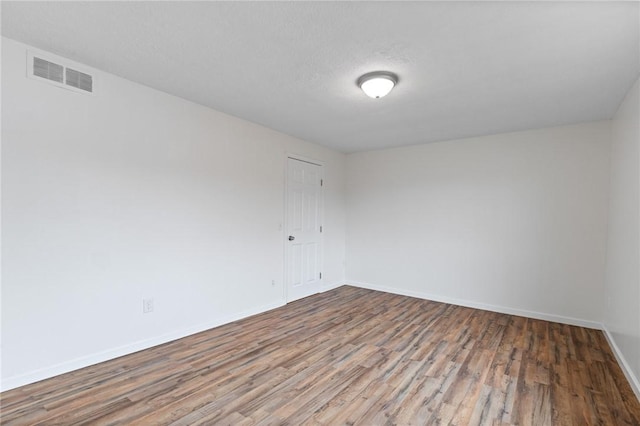 275 Owens Rd Unit 115, Sweden, NY 14420 - spare room with wood finished floors and baseboards