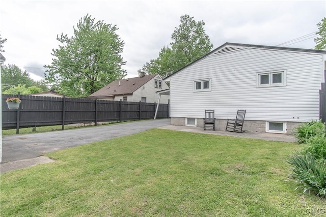 1039 Holcomb St, Watertown-City, NY 13601 - back of property featuring a patio area