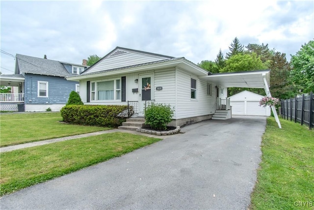 1039 Holcomb St, Watertown-City, NY 13601 - bungalow with a garage, entry steps, and an outbuilding