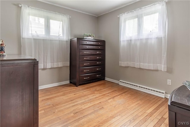 1039 Holcomb St, Watertown-City, NY 13601 - office with a baseboard radiator, light wood-style floors, ornamental molding, and baseboards