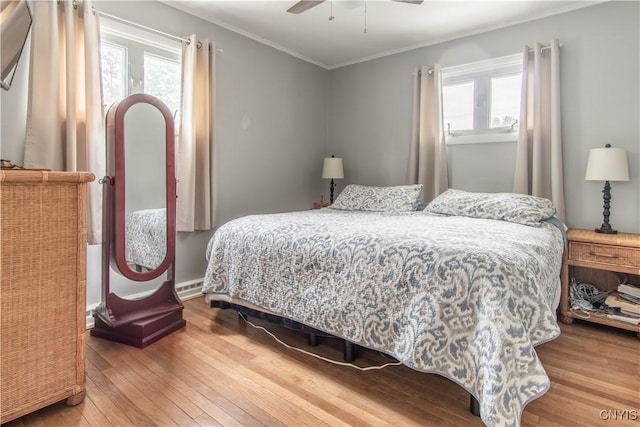1039 Holcomb St, Watertown-City, NY 13601 - bedroom featuring hardwood / wood-style flooring, ornamental molding, and ceiling fan