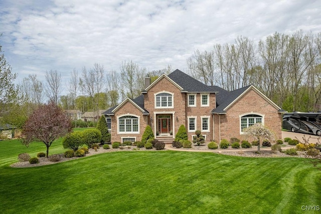 1968 Penfold Way, Lysander, NY 13027 - colonial house featuring a chimney, brick siding, and a front yard