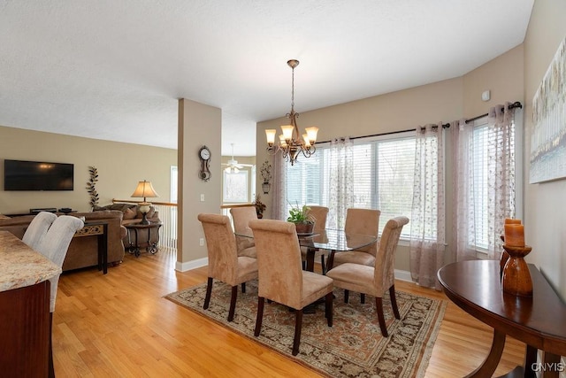 1968 Penfold Way, Lysander, NY 13027 - dining space featuring a chandelier, light wood-style floors, and baseboards