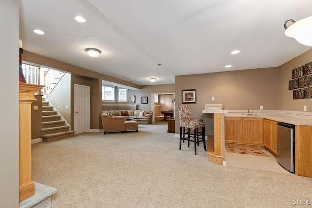 1968 Penfold Way, Lysander, NY 13027 - living area with light carpet, wet bar, stairs, recessed lighting, and baseboards