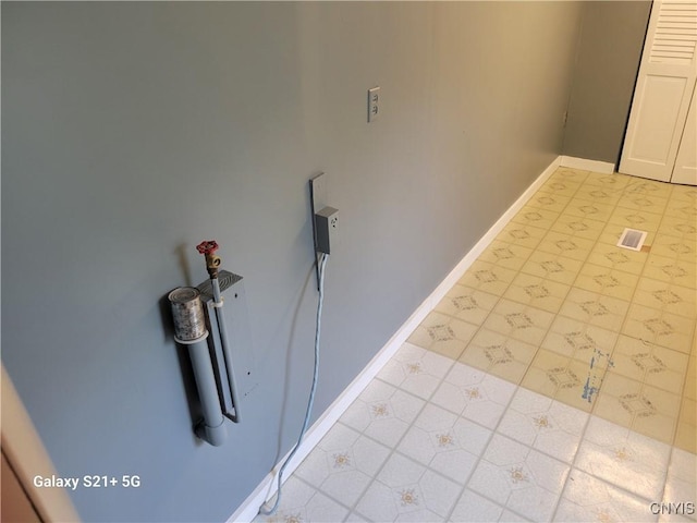8723 E Mud Lake Rd, Lysander, NY 13027 - laundry room featuring baseboards