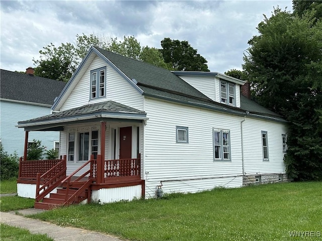 23 Cayuga St, Buffalo, NY 14211 - view of front of house with a porch, a front lawn, and roof with shingles
