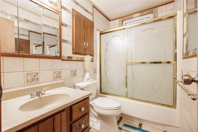 7425 Eelpot Rd, Naples, NY 14512 - bathroom featuring tile walls, toilet, shower / bath combination with glass door, vanity, and a textured ceiling