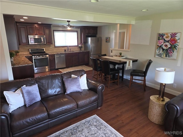 3508 Warner Dr, Grand Island, NY 14072 - living area featuring dark wood-style floors, baseboards, and recessed lighting