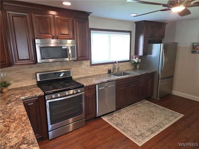 3508 Warner Dr, Grand Island, NY 14072 - kitchen with stainless steel appliances, a sink, ceiling fan, baseboards, and dark wood-style flooring