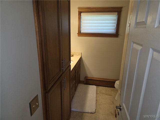 3508 Warner Dr, Grand Island, NY 14072 - bathroom featuring toilet, vanity, and baseboards