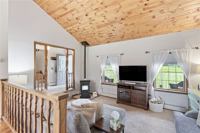 101 Winchell Rd, Owego, NY 13827 - carpeted living room with a baseboard radiator, a wood stove, wood ceiling, high vaulted ceiling, and a baseboard heating unit