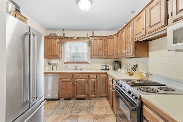 101 Winchell Rd, Owego, NY 13827 - kitchen featuring stainless steel appliances, a sink, light countertops, and decorative backsplash