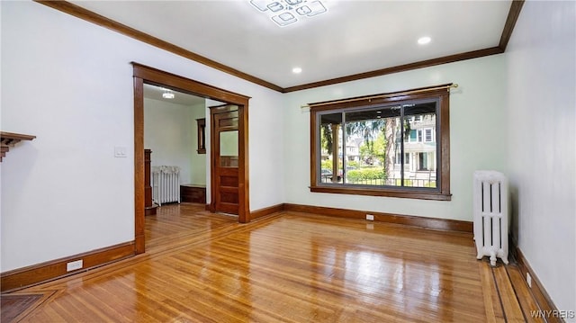 54 Meech Ave, Buffalo, NY 14208 - spare room with radiator heating unit, crown molding, light wood-type flooring, and baseboards