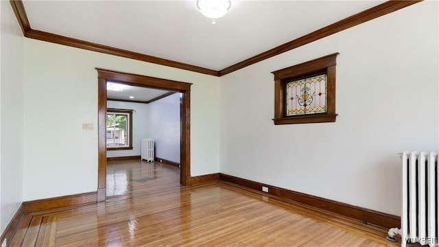 54 Meech Ave, Buffalo, NY 14208 - empty room featuring radiator heating unit, ornamental molding, light wood finished floors, and baseboards