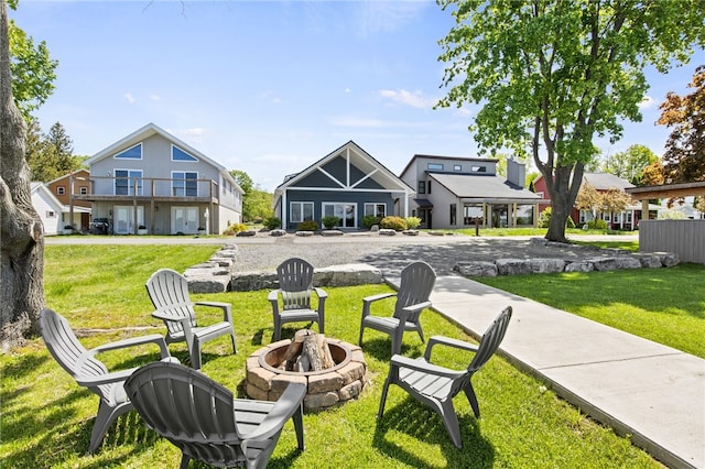 8419 Old Lake Rd, Lodi, NY 14860 - surrounding community with an outdoor fire pit and a lawn