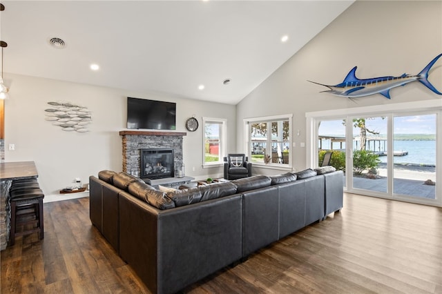 8419 Old Lake Rd, Lodi, NY 14860 - living room with a fireplace, dark wood-style floors, high vaulted ceiling, and recessed lighting