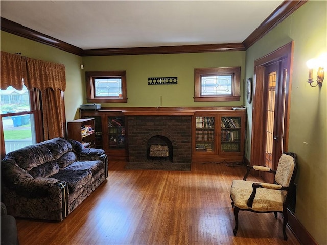 83 Vermont St, Rochester, NY 14609 - living room featuring ornamental molding, plenty of natural light, wood finished floors, and a brick fireplace