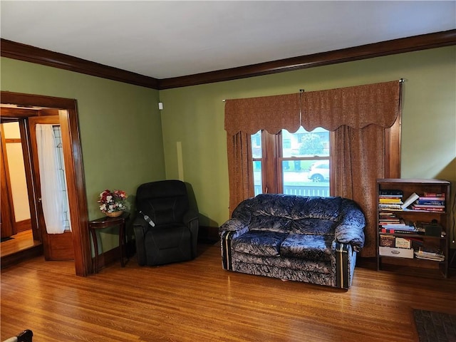 83 Vermont St, Rochester, NY 14609 - living room featuring wood finished floors, ornamental molding, and baseboards