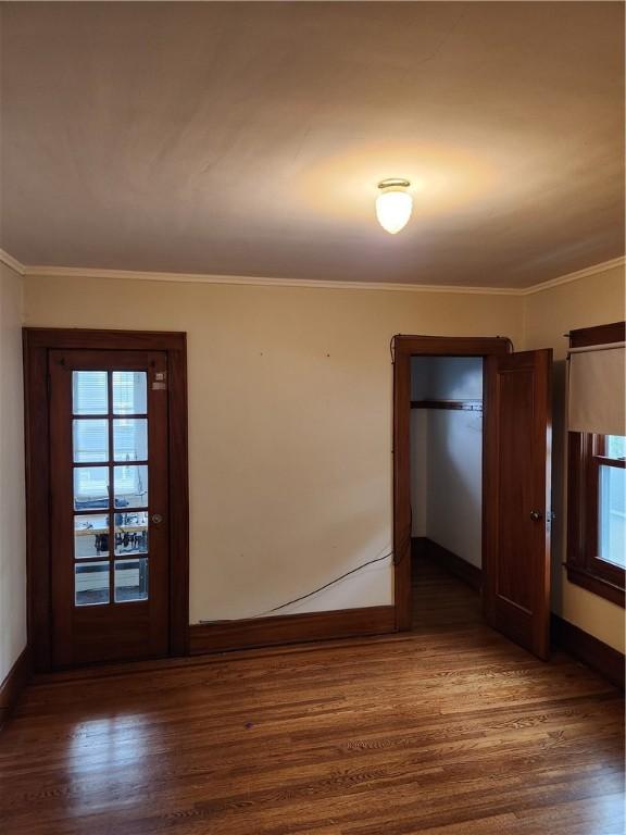 83 Vermont St, Rochester, NY 14609 - unfurnished room with baseboards, wood finished floors, and ornamental molding