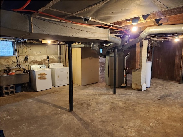 83 Vermont St, Rochester, NY 14609 - basement with washing machine and dryer, a sink, heating unit, and gas water heater