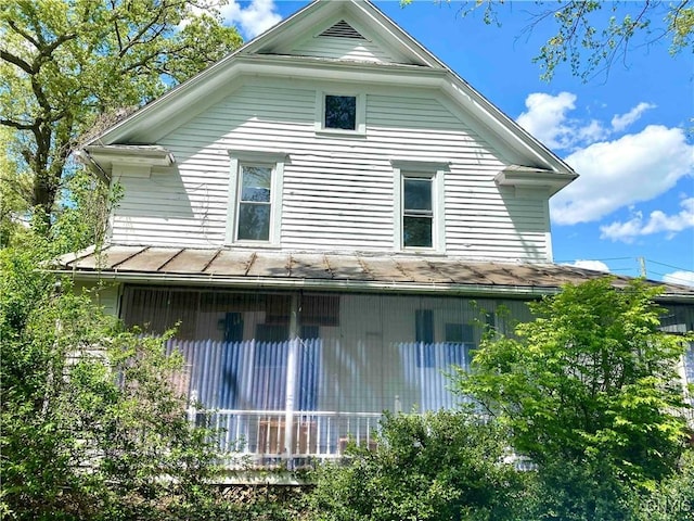 4 S St, Belfast, NY 14711 - view of side of home with a sunroom