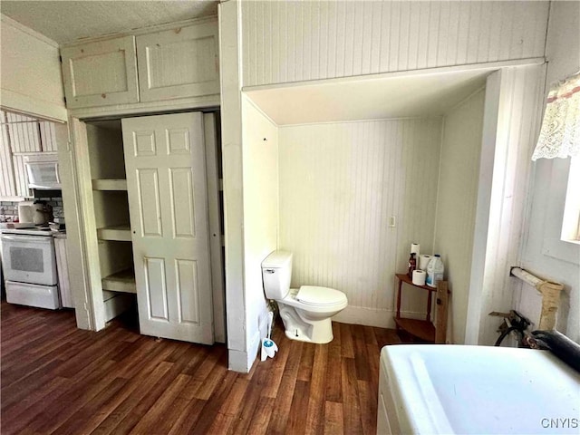 4 S St, Belfast, NY 14711 - bathroom with toilet, wood finished floors, and a tub to relax in