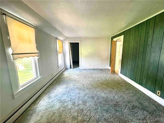4 S St, Belfast, NY 14711 - unfurnished room featuring a baseboard heating unit, carpet, baseboards, and wooden walls