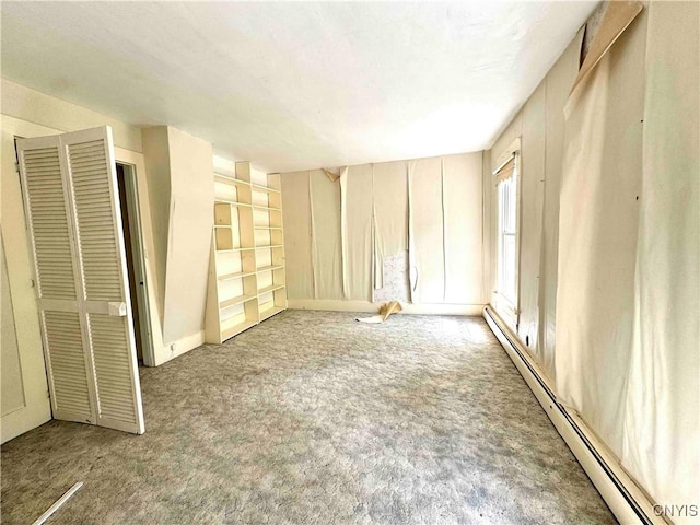 4 S St, Belfast, NY 14711 - unfurnished room featuring a baseboard heating unit and light carpet