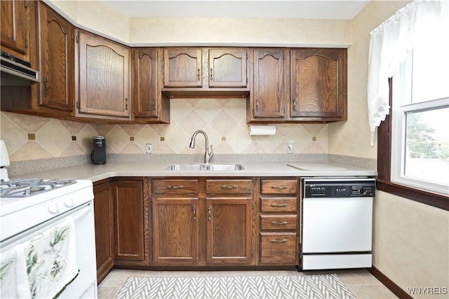 704 Beach Rd, Evans, NY 14006 - kitchen featuring white appliances, a sink, light countertops, and backsplash