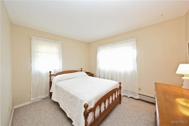 704 Beach Rd, Evans, NY 14006 - bedroom with baseboard heating, light carpet, and baseboards