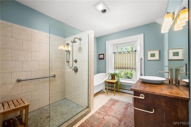 9940 Middle Rd, Pulteney, NY 14840 - full bathroom featuring baseboard heating, vanity, tiled shower, and a freestanding tub