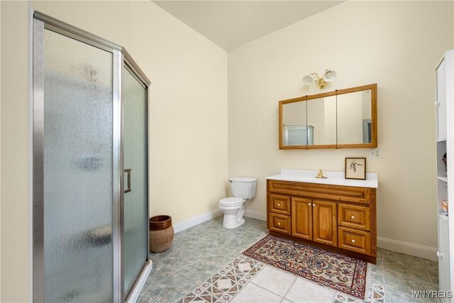 9940 Middle Rd, Pulteney, NY 14840 - full bath featuring vanity, a shower stall, baseboards, tile patterned floors, and toilet