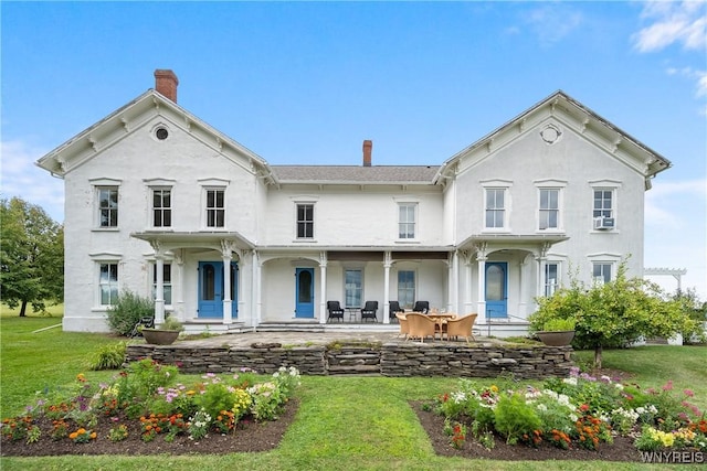 9940 Middle Rd, Pulteney, NY 14840 - italianate house with a chimney, stucco siding, a front lawn, and cooling unit