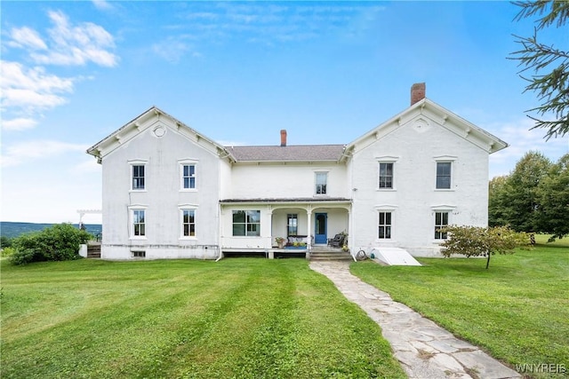 9940 Middle Rd, Pulteney, NY 14840 - rear view of house with a chimney, a lawn, covered porch, and stucco siding