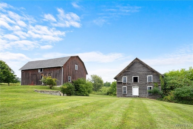 9940 Middle Rd, Pulteney, NY 14840 - back of house featuring a barn, a yard, and an outdoor structure