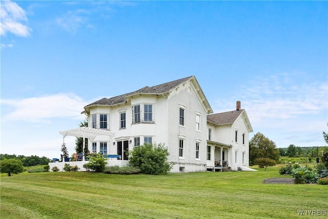 9940 Middle Rd, Pulteney, NY 14840 - view of home's exterior with a pergola, a lawn, and stucco siding