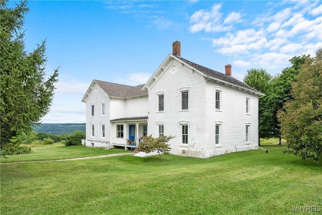 9940 Middle Rd, Pulteney, NY 14840 - back of property with a chimney, a lawn, and stucco siding