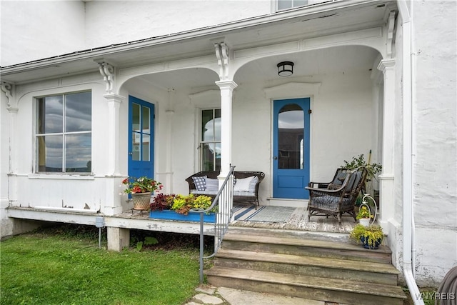 9940 Middle Rd, Pulteney, NY 14840 - view of exterior entry featuring covered porch and stucco siding