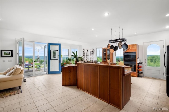 9940 Middle Rd, Pulteney, NY 14840 - kitchen featuring open floor plan, light tile patterned floors, plenty of natural light, a kitchen island, and recessed lighting