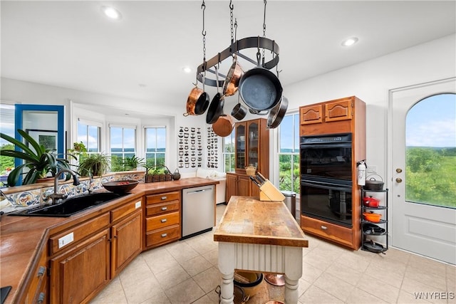 9940 Middle Rd, Pulteney, NY 14840 - kitchen featuring dishwasher, butcher block counters, a sink, healthy amount of natural light, and recessed lighting