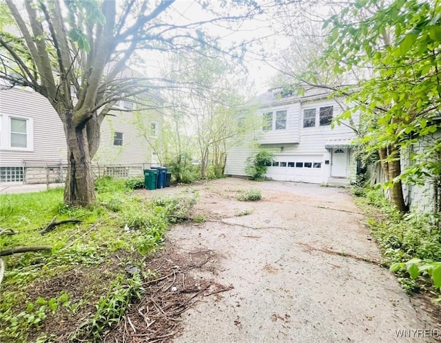 115 Stratford Rd, Buffalo, NY 14216 - view of yard with an attached garage and driveway