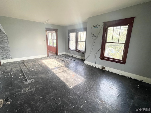 115 Stratford Rd, Buffalo, NY 14216 - unfurnished living room with baseboards