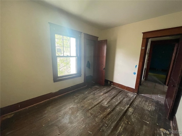115 Stratford Rd, Buffalo, NY 14216 - unfurnished bedroom featuring hardwood / wood-style flooring and baseboards