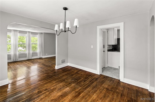 374 Victoria Blvd, Tonawanda-Town, NY 14217 - spare room with arched walkways, hardwood / wood-style floors, and baseboards